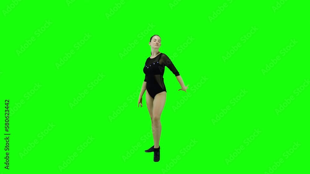 Sexy female dancer in a body suite dancing in front of a green screen Sexy female dancer in a body suite dancing in front of a green screen