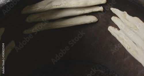 Shotis Puri Bread In A Georgian Clay Torne Oven. High Angle photo