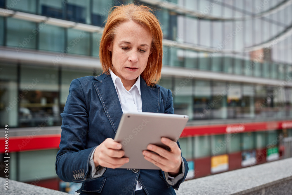 Fototapeta premium A tech-savvy businesswoman! Her digital skills and innovation drive progress while surrounded by the corporate world.