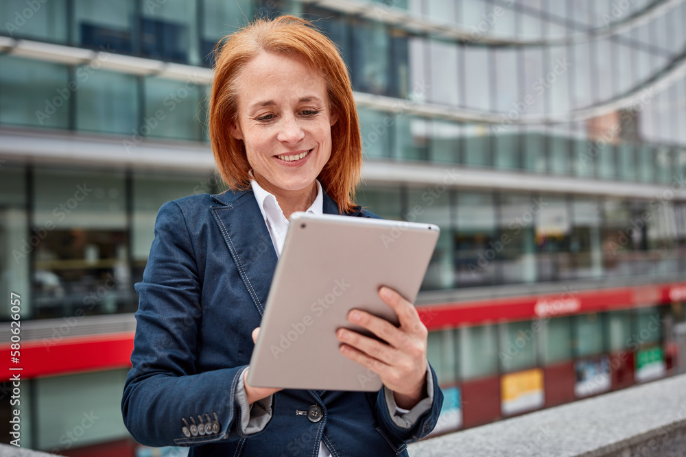 Fototapeta premium A tech-savvy businesswoman! Her digital skills and innovation drive progress while surrounded by the corporate world.