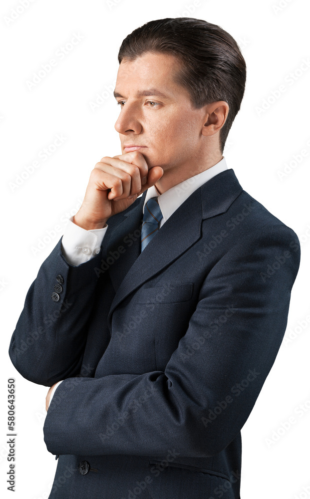 Business man stands with his fist on his chin and thinks Business man stands with his fist on his chin and thinks