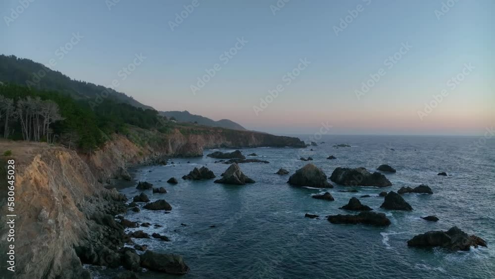 Drone shot of California's rocky northern coastline at sunset. Drone shot of California's rocky northern coastline at sunset.