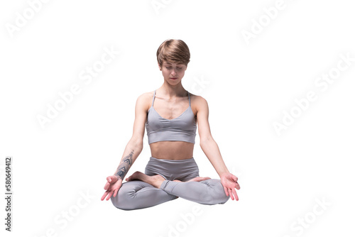 Young attractive Woman practicing home yoga, working out, wearing sportswear, isolated. Healthy life, keep fit concepts