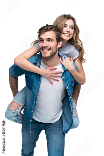 Cute portrait of couple. Guy rolls a girl on his back
