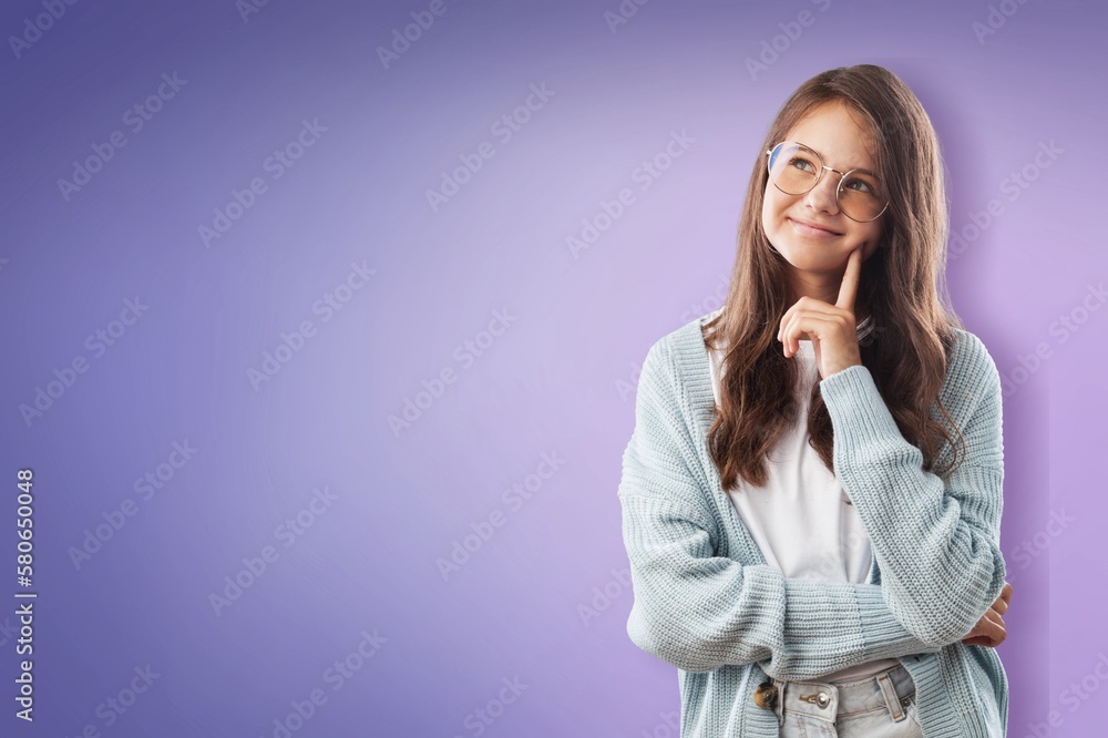 Clever smart school child posing on background Clever smart school child posing on background