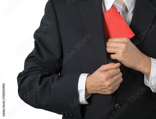 Businessman Putting an Envelope in his Pocket