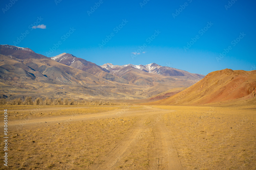 Road in Kyzyl-Chin valley or Mars valley with mountain background in Altai, Siberia, Russia.