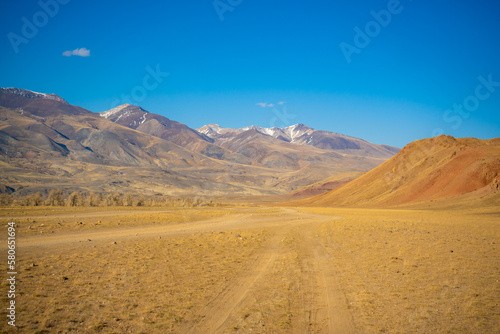 Road in Kyzyl-Chin valley or Mars valley with mountain background in Altai, Siberia, Russia.