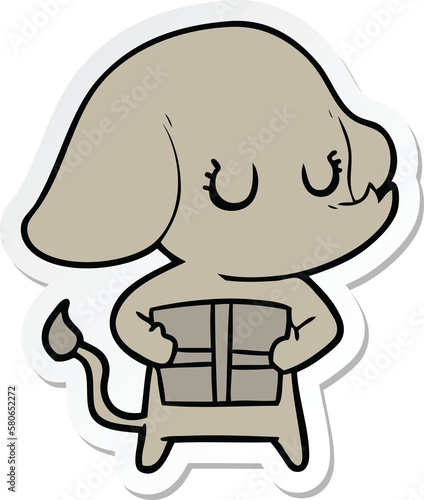 sticker of a cute cartoon elephant with gift