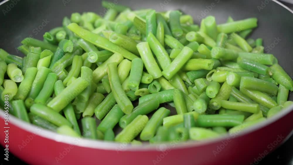Green beans ready for cooking in frying pan. Bio green beans. Cooking concept Green beans ready for cooking in frying pan. Bio green beans. Cooking concept