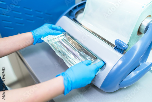 Packaged dental products in sealed packaging. Sterilization and disinfection in a modern dental clinic photo