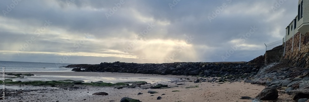 Harbour with sun rays through clouds