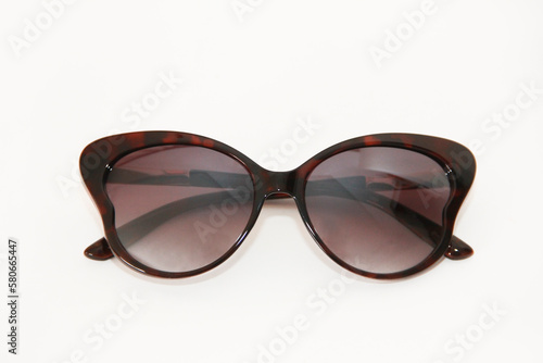Women's sunglasses with dark lenses in a plastic frame