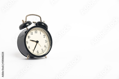 black vintage alarm clock isolated on white background, Time concept, 9:35 o'clock. Morning, reminder.