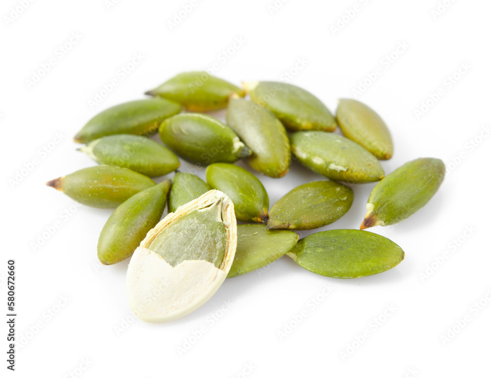The pile of raw pepitas isolated on white. The pile of raw pepitas isolated on white.
