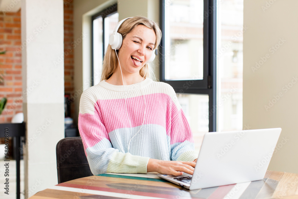 pretty young woman working at home with a laptop. house interior design pretty young woman working at home with a laptop. house interior design