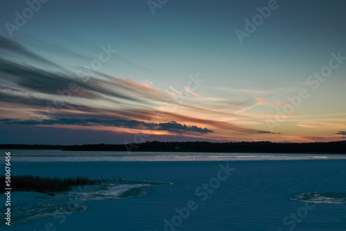 sunset over lake mamry in winter