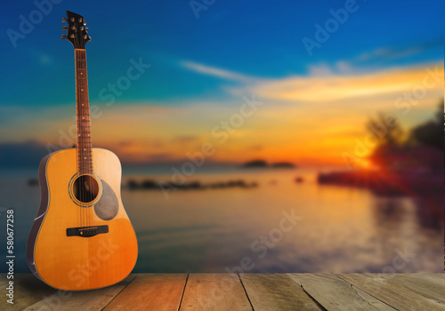 Obraz na płótnie wooden guitar natural view, sea, setting sun Musical nature, wooden floors, travel, views, musical instruments, conveying music and nature