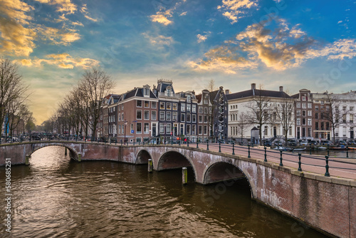 Amsterdam Netherlands, sunset city skyline at canal waterfront