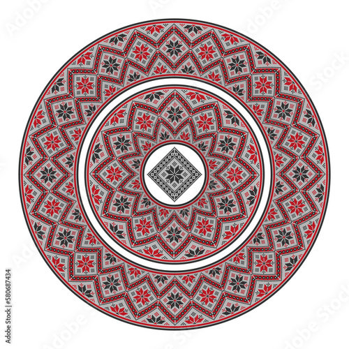 Round plate with a pixelated geometric pattern in warm colors