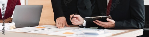 Close up of business team Diverse colleagues gather brainstorm discuss financial statistics at office meeting. finance, teamwork, data Graphs Charts concept