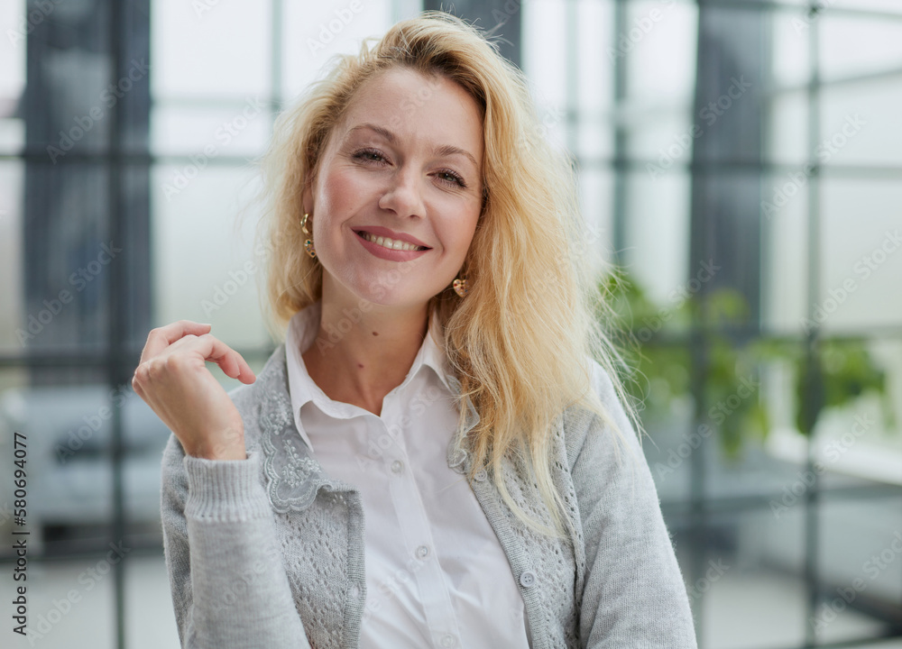 Portrait of a young beautiful business woman in the office Portrait of a young beautiful business woman in the office