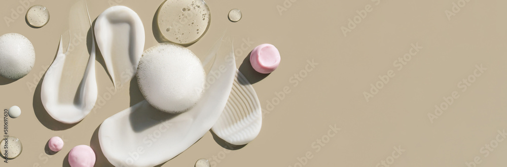 cosmetic smears of creamy texture on a beige background cosmetic smears of creamy texture on a beige background