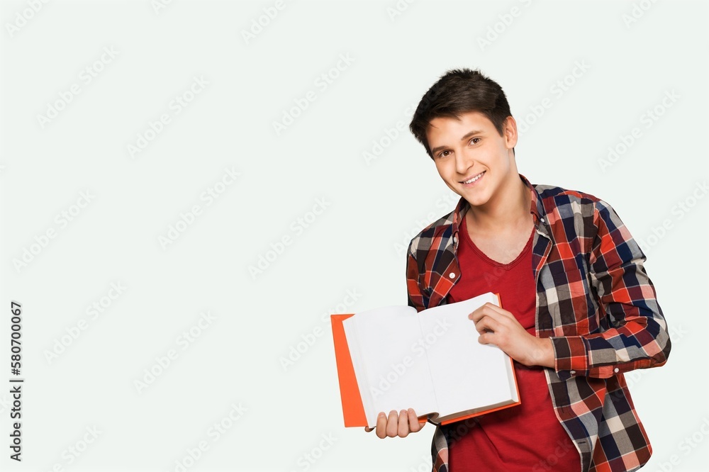 Young happy teen college student holding books, Young happy teen college student holding books,