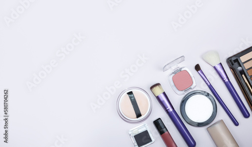 Decorative cosmetic set on color background. Copy space