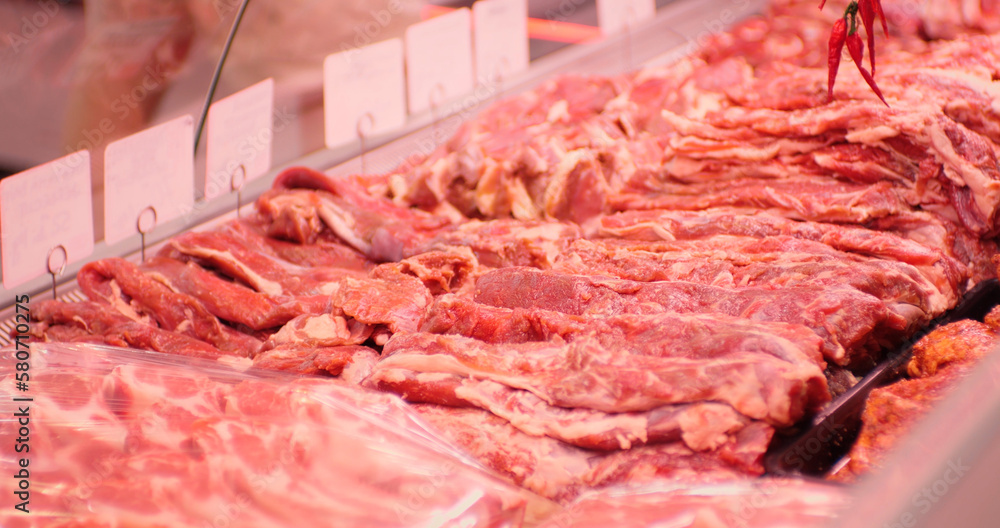 Raw lamb meat freshly brought to market for sale. Selection of meat in a store. Food industry concept.