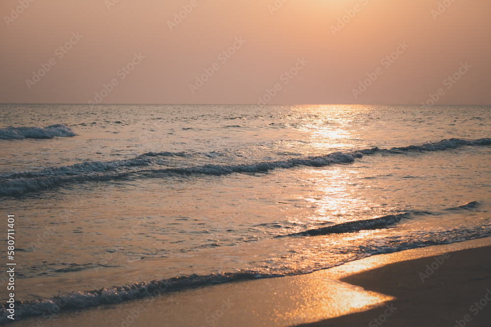 beautiful sunset or sunrise with sea and beach. warm tone