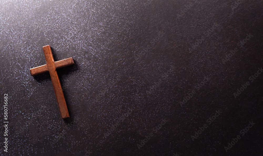 Good Friday and Holy week concept - A religious cross on dark stone background. - obrazy, fototapety, plakaty 