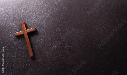 Fotografiet Good Friday and Holy week concept - A religious cross on dark stone background