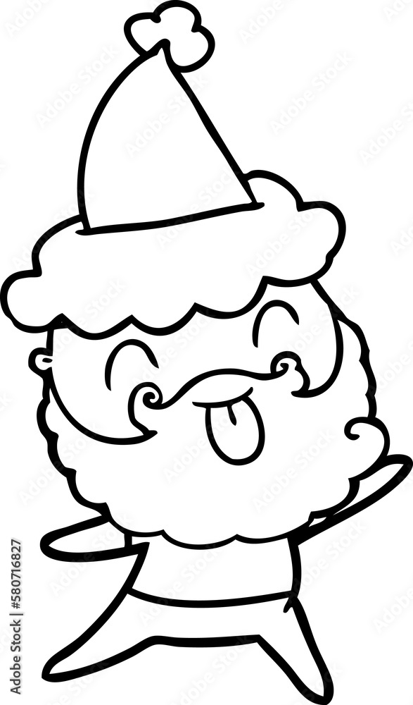 man with beard sticking out tongue wearing santa hat man with beard sticking out tongue wearing santa hat