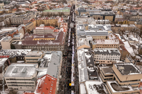 Drone photography of fair in a city center and a large crowd of people