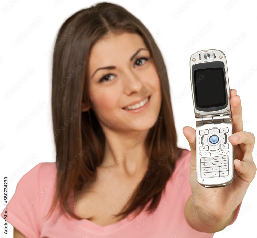 Friendly Young Woman Shows Mobile Phone - Isolated Friendly Young Woman Shows Mobile Phone - Isolated