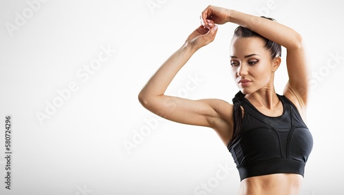 Fototapeta Naklejka Na Ścianę i Meble -  Young happy fitness sports girl posing