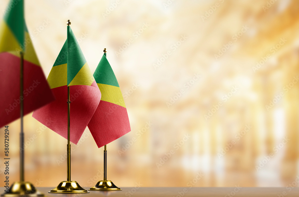 Small flags of the Congo on an abstract blurry background