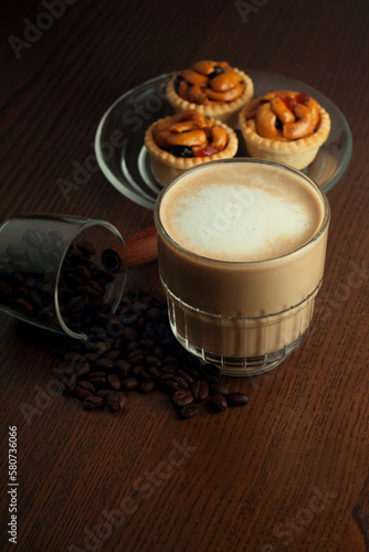 Hot coffee and coffee beans and grain tarts