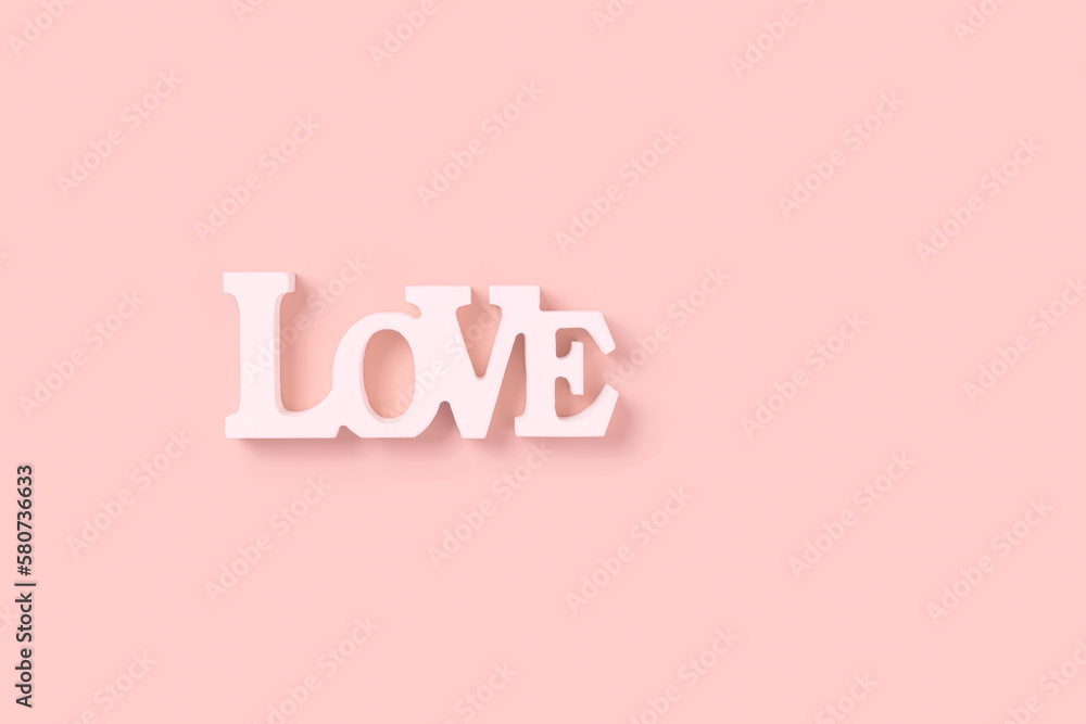 Word love, White wooden text love on pastel pink color background, Happy Valentines Day, Mothers Day, March 8, World Womens Day holiday card concept. Flat lay, top view, copy space Word love, White wooden text love on pastel pink color background, Happy Valentines Day, Mothers Day, March 8, World Womens Day holiday card concept. Flat lay, top view, copy space