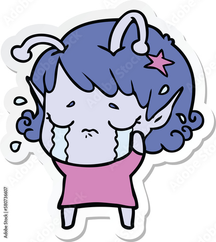 sticker of a cartoon crying alien girl