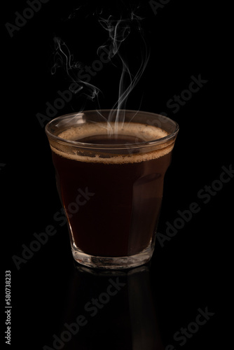 Hot espresso coffee on black background
