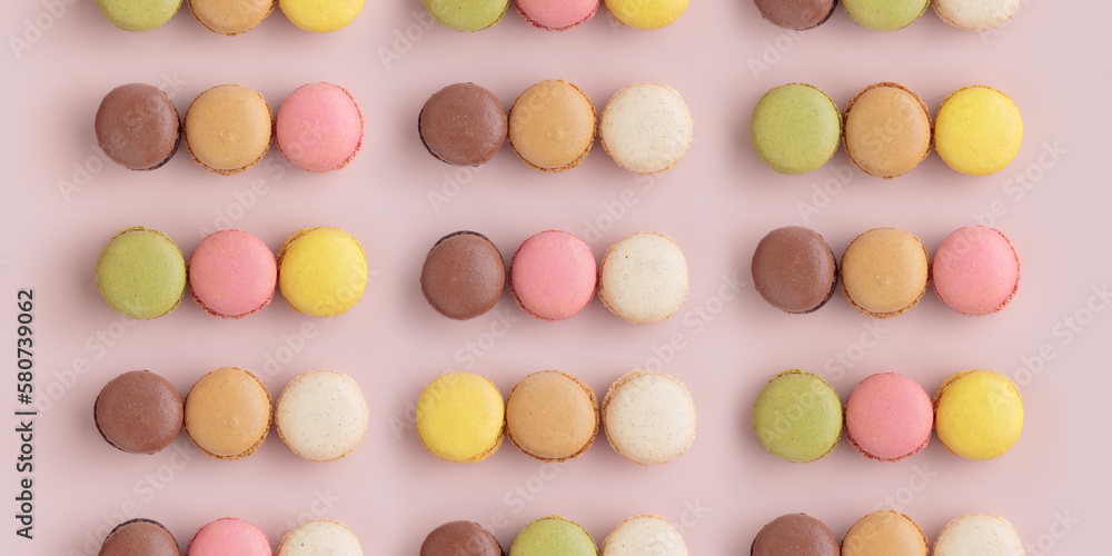 Macaroon pattern on pink background, colorful french cookies pattern. Gift for 8 March, International Women's Day, Valentine Day Macaroon pattern on pink background, colorful french cookies pattern. Gift for 8 March, International Women's Day, Valentine Day