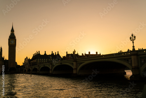 People walking across Westminster Bridge, Big Ben at Sunset in London, England