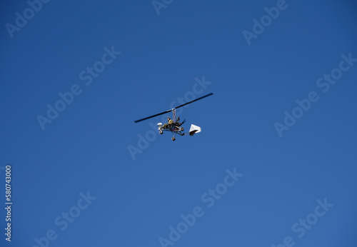 Ultralight autogyro in flight, Gran Canary, Spain