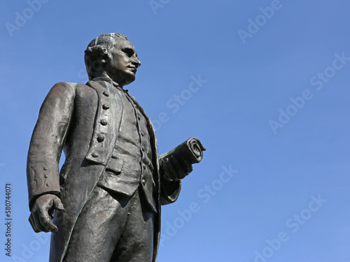 A statue of the famous explorer Captain James Cook.  The statue is located in the harbor of Victoria, British Columbia, Canada..