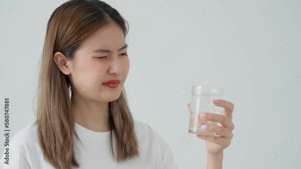 Asian woman feel sensitive teeth after drinking cold, female suffer tooth, decay problems, dental care, tooth extraction, decay problem, bad breath, Gingival Recession, Oral Hygiene instruction Asian woman feel sensitive teeth after drinking cold, female suffer tooth, decay problems, dental care, tooth extraction, decay problem, bad breath, Gingival Recession, Oral Hygiene instruction