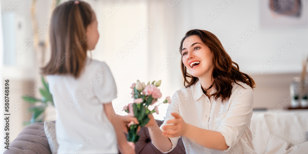 Daughter giving mother bouquet of flowers. Daughter giving mother bouquet of flowers.