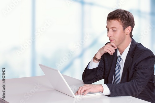 Young business person work on laptop computer at office