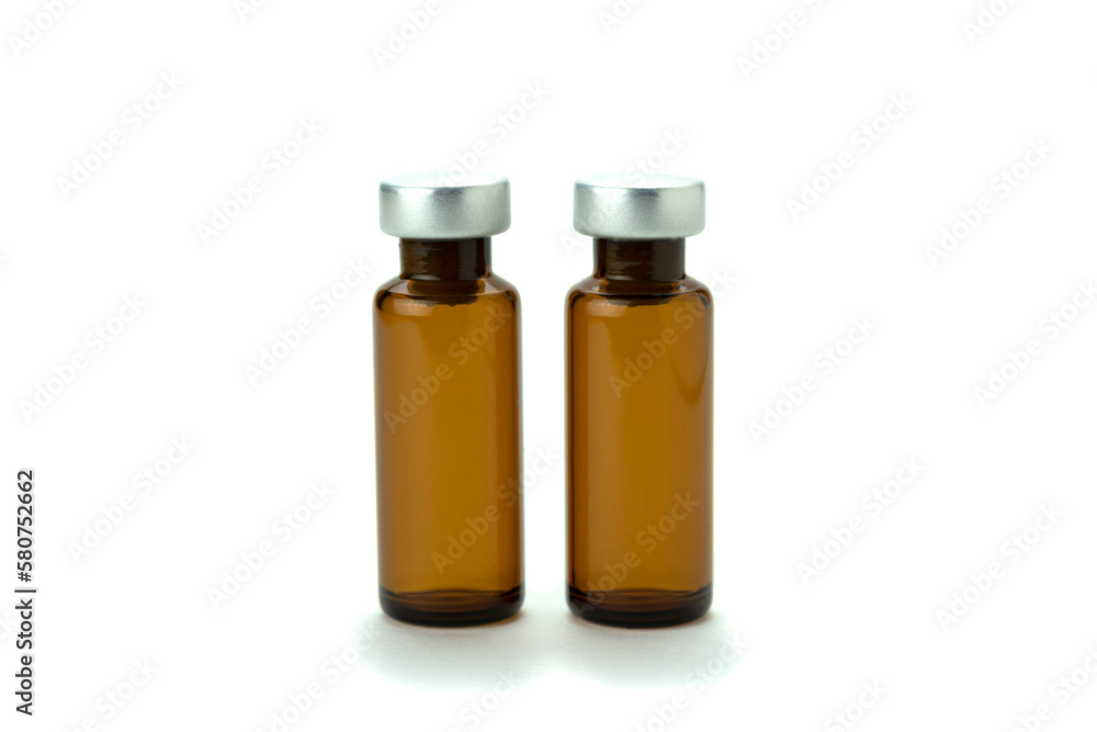 Medical bottle of brown color, for medicine and injection, with a lid, isolated on a white background.